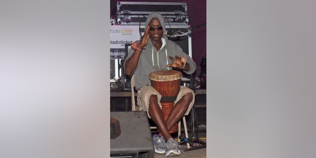 Aug. 31, 2013: In this photo, Lenin Roberto Arana, whose stage name is Canario, plays a traditional Garifuna drum during a concert in Roatan, Honduras.