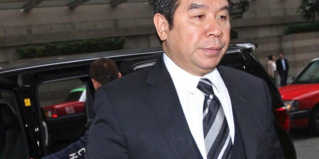 Hong Kong businessman Carson Yeung, also owner of Birmingham City football club, arrives for the verdict in his money laundering trial at Hong Kong District Court Monday, March 3, 2014. Yeung was found guilty of money laundering by the Hong Kong District Court and was convicted over charges relating to his handling of 721 million Hong Kong dollars ($93 million) using five bank accounts between January 2001 and December 2007. (AP Photo)