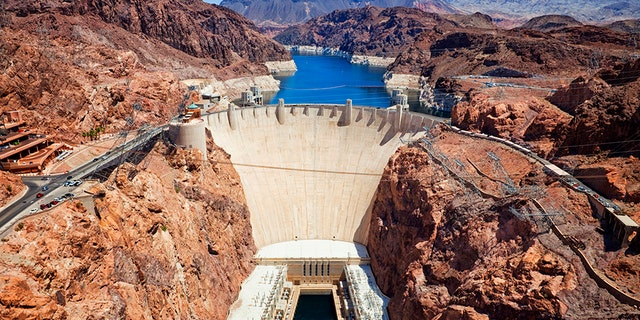 A man, possibly armed, barricaded himself inside an armored vehicle somewhere near the Hoover Dam and U.S. Highway 93 southbound, reports say.