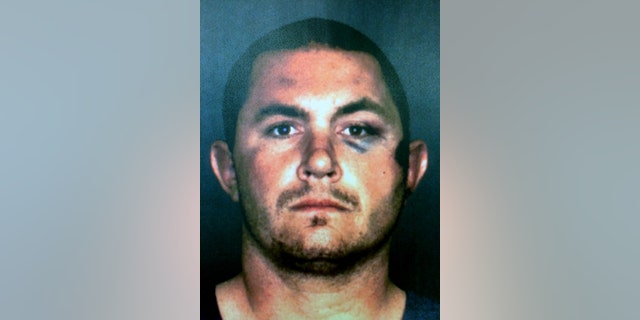 FILE - This undated booking photo provided by the San Bernardino County Sheriff's Department shows Francis Pusok, of Apple Valley, Calif. The county approved paying a $650,000 settlement to avoid a lawsuit by Pusok, whose beating by deputies after a horse chase was captured on video and led to a federal civil rights investigation. (San Bernardino County Sheriff's Department via AP, File)