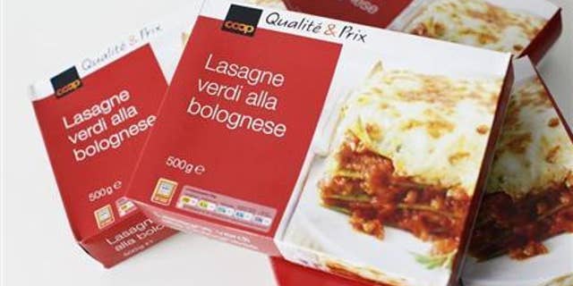 500g size boxes of Coop Qualite & Prix Lasagne Verdi Bolognese are seen after purchase from a Coop supermarket in Zurich, February 12, 2013. The Lasagne Verdi Bolognese contains elements of horsemeat, the company said on Wednesday. REUTERS/Michael Buholzer