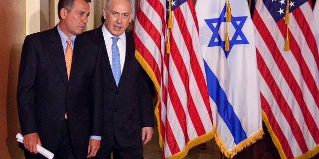 FILE - In this May 24, 2011 file photo, Israeli Prime Minister Benjamin Netanyahu walks with House Speaker John Boehner of Ohio on Capitol Hill in Washington. Israel’s ambassador to the US has gotten an earful from a half-dozen House Democrats angered by Prime Minister Benjamin Netanyahu’s acceptance of a Republican invitation to address Congress next month. Boehner’s invitation came with the Obama administration in negotiations with Iran over its nuclear program. Boehner’s move has angered the White House and Democrats. (AP Photo/Evan Vucci, File)