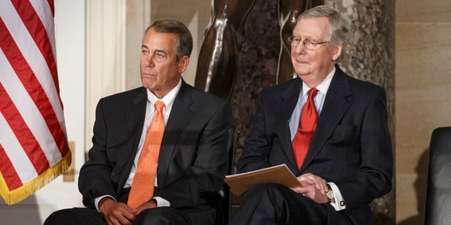 House Speaker John Boehner of Ohio, and Senate Majority Leader Mitch McConnell of Ky. attend a statue unveiling ceremony honoring former Arizona Sen. Barry Goldwater, Wednesday, Feb. 11, 2015, on Capitol Hill in Washington. Boehner and McConnell are at a standstill over provisions attached to a Homeland Security spending bill aimed at blocking President Barack Obama's executive actions on immigration. McConnell declared a Senate stalemate Tuesday and called on the House to make the next move to avoid an agency shutdown. House Republicans said they had no intention of doing so and today, Wednesday, Feb. 11, 2015, Speaker Boehner declared that Senate Democrats should "get off their ass" and pass a bill to fund the Homeland Security Department and restrict President Barack Obama's executive moves on immigration.  (AP Photo/J. Scott Applewhite)