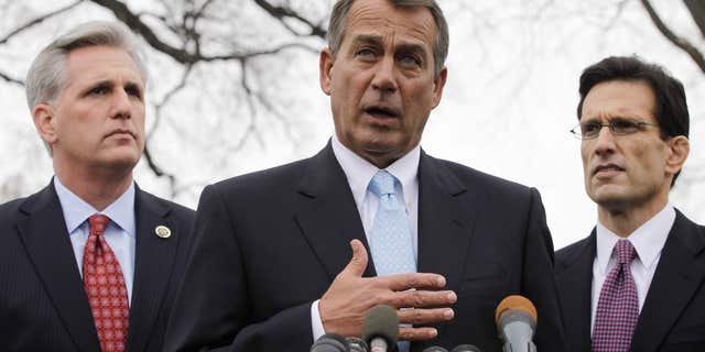 In this Feb. 9, 2011, file photo House Speaker John Boehner of Ohio, center, with House Majority Leader Eric Cantor of Va., right, and House Majority Whip Kevin McCarthy of Calif., speaks to reporters outside the White House in Washington. (AP)