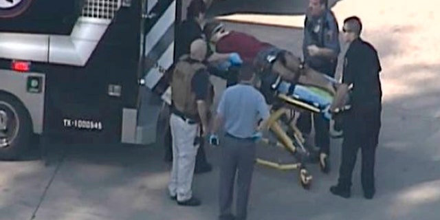 Jan. 22, 2013: In this frame grab provided by KPRC Houston, an unidentified person is transported by emergency personnel at Lone Star College Tuesday in Houston, where law enforcement officials say the community college is on lockdown amid reports of a shooter on campus.