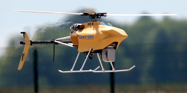 An Hovereye-Ex drone flies during an exhibition at Bretigny-sur-Orge, near Paris, May 14, 2014. REUTERS/Charles Platiau