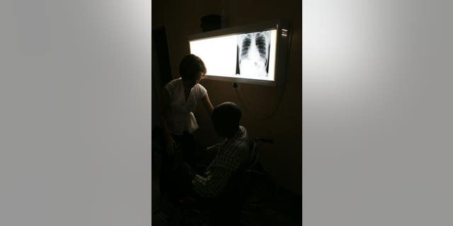 File photo of a radiologist and a patient.