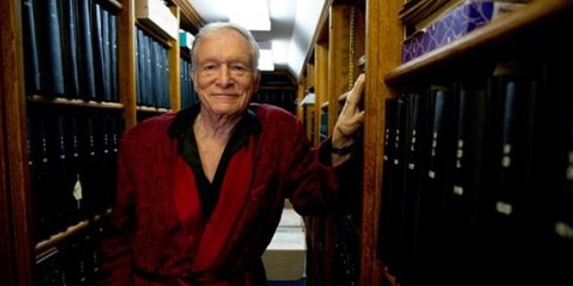 In this Oct. 13, 2011 photo, Playboy Enterprises' Hugh Hefner poses for a photograph at his home at the Playboy Mansion in Beverly Hills, Calif.