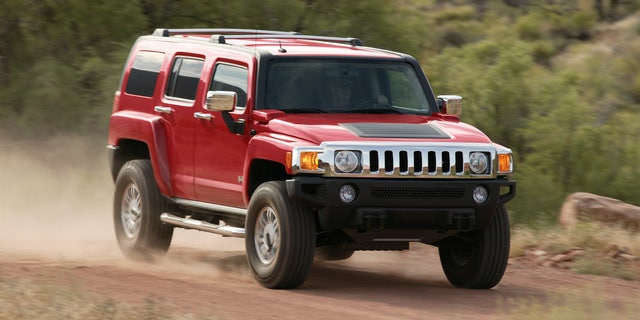 FILE - In this undated photo provided by General Motors a 2006 Hummer H3 is driven. General Motors said Wednesday, May 5, 2010, that it is recalling all Hummer H3s produced since the 2006 model year to fix a portion of the hood that can detach during driving. Hummer spokesman Nick Richards said a device on the hood called a hood louver can come loose and possibly detach while driving. (AP Photo/General Motors, File) ** NO SALES **