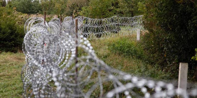 A part of the temporary fence is seen at the green border between Hungary and Croatia at Zakany, 234 kms southwest of Budapest, Hungary, Tuesday, Sept. 29, 2015. (Gyorgy Varga/MTI via AP)