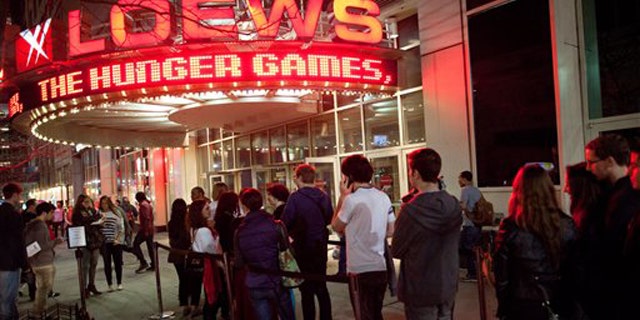 March 22, 2012: Fans line up to see the midnight shows of "The Hunger Games," at the 34th Street Loews AMC Theatre in New York.