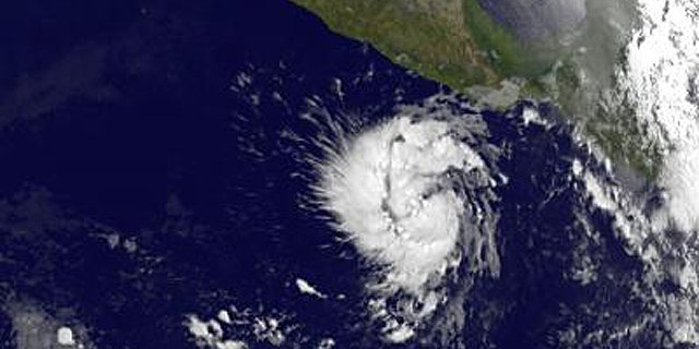 This infrared image of Tropical Storm Adrian was taken from the GOES-11 satellite on June 8 at 12:00 UTC (8:00 a.m. EDT) and shows a compact, rounded storm off the western Mexico coast. The image reveals that Adrian has some higher, stronger thunderstorms in the center that are casting shadows on lower clouds around them.