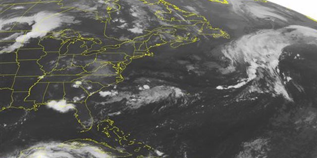 This NOAA satellite image taken Thursday, Aug. 04, 2016, at 12:45 AM EDT, shows a line of strong thunderstorms making its way across northern Minnesota due to an advancing cold front. This line of storms is quickly moving eastward. More scattered showers and storms can be seen on the backend of complex across the northern and central Plains. Scattered showers and storms can be seen across the Southeast, while mostly clear conditions persist for much of the Great Lakes and Northeast. Hurricane Earl can be seen making landfall over Belize in the southern Gulf. (NOAA/Weather Underground via AP)