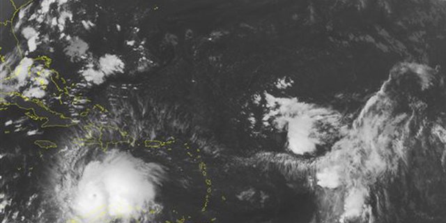 This NOAA satellite image taken Saturday, Oct. 1, 2016 at 12:45 AM EDT shows well defined Hurricane Matthew continuing to slowly move westward at about 7 MPH across the Caribbean. Recent reconnaissance missions have revealed max sustained wind speeds up to 160 MPH, bringing Matthew up to a category 5 hurricane. Some of the outer bands can be seen pushing into Hispaniola, as well as Venezuela and Columbia. Matthew is expected to begin its northward turn over the next few days, largely impacting Jamaica next.  (NOAA/Weather Underground via AP)