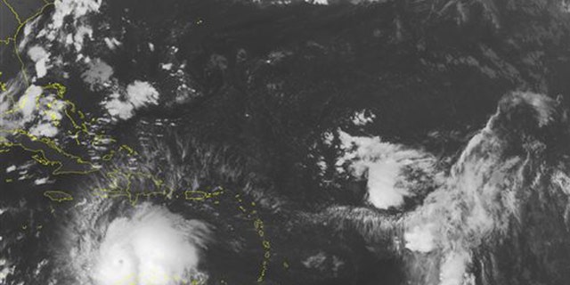 This NOAA satellite image taken Saturday, Oct. 1, 2016 at 12:45 AM EDT shows well defined Hurricane Matthew continuing to slowly move westward at about 7 MPH across the Caribbean. Recent reconnaissance missions have revealed max sustained wind speeds up to 160 MPH, bringing Matthew up to a category 5 hurricane. Some of the outer bands can be seen pushing into Hispaniola, as well as Venezuela and Columbia. Matthew is expected to begin its northward turn over the next few days, largely impacting Jamaica next. (NOAA/Weather Underground via AP)