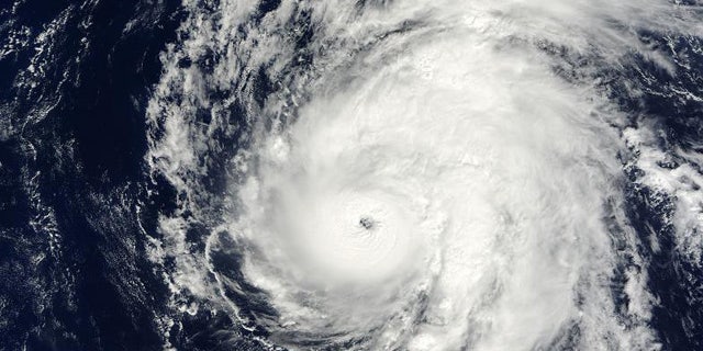 Hurricane Neki swirls through the oceans west of Hawaii.