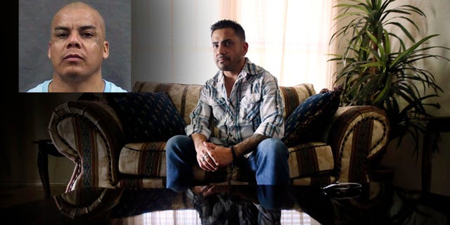 Marcus Calvillo's image is reflected in a coffee table at his parents home as he poses for a photo in Grand Prairie, Texas.