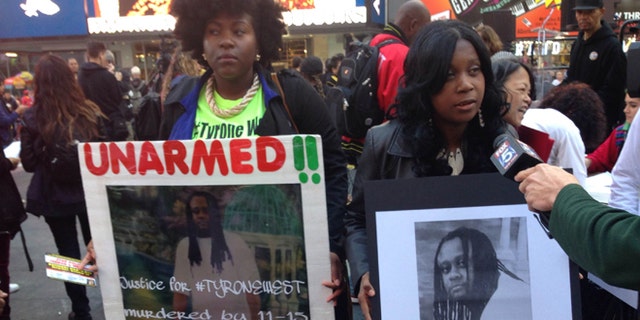 Qiara Butler, left, and Tawanda Jones demonstrate during a rally against "police brutality and murder" in Times Square on Oct. 22.