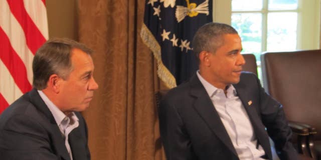 House Speaker John Boehner and President Obama Saturday, July 23, 2011 in the Cabinet Room at the White House/Travel Pool photo.