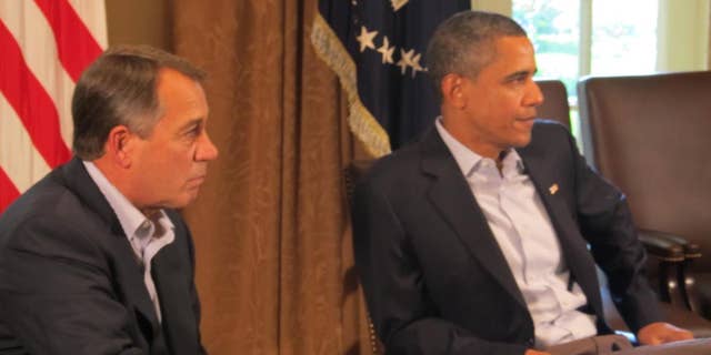 House Speaker John Boehner and President Obama Saturday, July 23, 2011 in the Cabinet Room at the White House/Travel Pool photo.