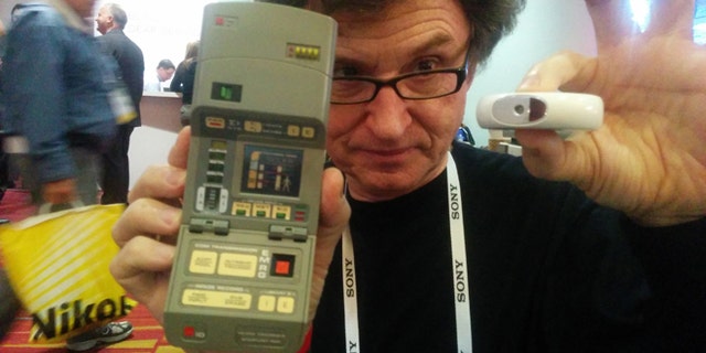 In Walter De Brouwer's right hand, the tricorder used on the TV series "Star Trek." In his left hand, a real-world version he has invented.