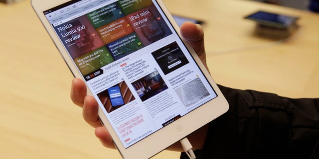FILE 2012: A shopper checks out the new Apple iPad mini at the Apple store on Michigan Ave. in Chicago.