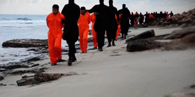 In this February video, which some experts believe was manipulated, ISIS fighters march poor Egyptian fisherman along the beach before beheading them. (Screengrab)