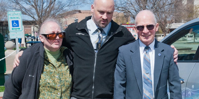 April 25: Alan Beaman center, walks with his parents, Carol and Barry Beaman after formally being declared innocent at a hearing at the Champaign County Courthouse in Urbana, Ill.