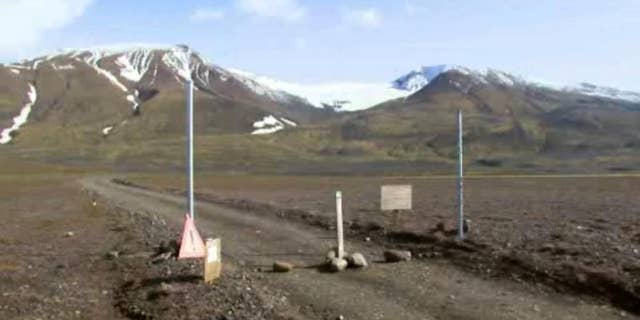 In an in an image from an Aug. 19, 2014 video, a sign is posted on the road next to Bardarbunga, a subglacial stratovolcano located under Iceland's largest glacier. On Saturday, Aug. 23, 2014, Iceland closed airspace over the Bardarbunga volcano on Saturday after the Meteorological Office said an eruption had begun under the ice of Europe’s largest glacier. The English portion of the sign reads, ""Uncertainty phase due to unrest in Bardarbunga". (AP Photo/Courtesy Channel 2 Iceland)