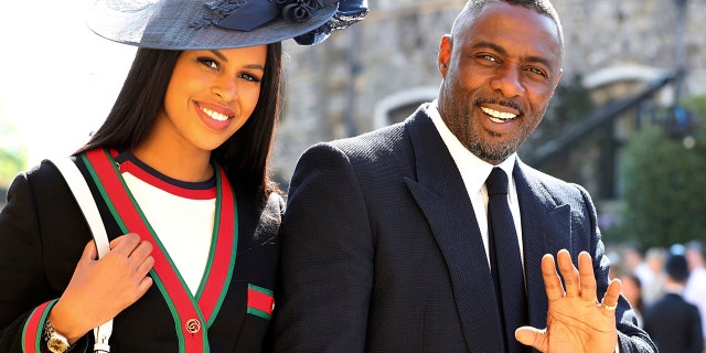 Idris Elba and Sabrina Dhowre arrive for the wedding ceremony of Prince Harry and Meghan Markle at St. George's Chapel in Windsor Castle in Windsor, near London, England, Saturday, May 19, 2018. (Gareth Fuller/pool photo via AP)