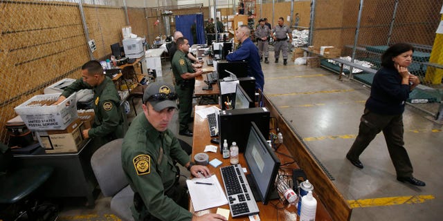 FILE: June 18, 2014: U.S. Customs and Border Protection at the Customs and Border Protection Nogales Placement Center in Nogales, Ariz.