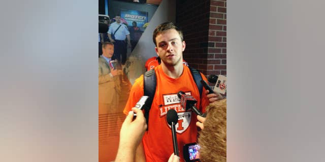 Illinois quarterback Wes Lunt talks with reporters at Memorial Stadium in Champaign, Ill., on Wednesday, Aug. 20, 2014, after learning he will be the starting Illini quarterback. Lunt transferred from Oklahoma State after starting as a freshman but sat out last season under NCAA transfer rules. Illinois starts its season Aug. 30 against Youngstown State. (AP Photo/David Mercer)