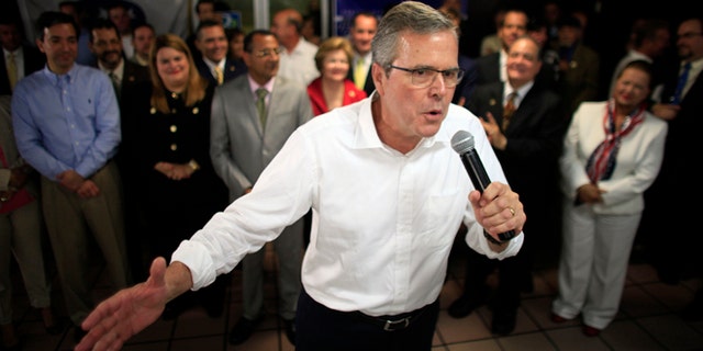 Jeb Bush speaks at a town hall meeting April 28, 2015. Hillary Rodham Clinton's challenge to the GOP on immigration is an early counter to Jeb Bush and other Republican White House contenders seeking Hispanic voters. Among them are GOP lawmakers who once opposed an immigration overhaul in Congress but now say they may be willing to allow millions living in the country illegally to stay. (AP Photo/Ricardo Arduengo)
