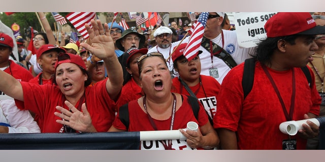 PHOENIX - JULY 29: Protesters from California join Arizonans at the state capitol building for a demonstration against Arizona's immigration enforcement law SB 1070 on July 29, 2010 in Phoenix, Arizona. The Californians came in solidarity with Arizonan opponents of the law, which many people saw as biased against Latinos. U.S. District Court Judge Susan Bolton Wednesday suspended several controversial provisions of the law, which went into effect today. (Photo by John Moore/Getty Images)