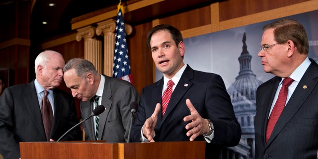 Sen. Marco Rubio, R-Fla., center, and Sen. Robert Menendez, D-N.J., far right.