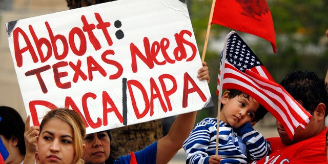 March 19, 2015: Over 100 hundred people demonstrate in favor of President Obama's immigration executive orders in front of the Federal Courthouse in Brownsville, Texas. (AP Photo/Brownsville Herald, Brad Doherty)