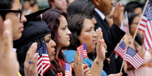 DREAMers (Development, Relief, and Education for Alien Minors) and parents take an oath in a mock citizenship ceremony during a "United we Dream," rally on Capitol Hill in Washington, Wednesday, July 10, 2013, sending a signal to the House of Representativesâ GOP leadership as they go into their meeting that afternoon to discuss immigration reform with their caucus. (AP Photo/Alex Brandon)