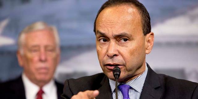 Rep. Luis Gutierrez, D-Ill., speaks during a news conference about immigration raids targeting Central American families with children, on Capitol Hill in Washington, on Tuesday, Jan. 12, 2016. At left is House Minority Whip Rep. Steny Hoyer, of Maryland. (AP Photo/Jacquelyn Martin)