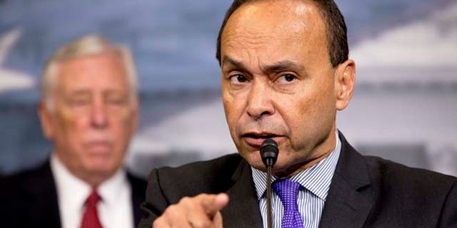 Rep. Luis Gutierrez, D-Ill., speaks during a news conference about immigration raids targeting Central American families with children, on Capitol Hill in Washington, on Tuesday, Jan. 12, 2016. At left is House Minority Whip Rep. Steny Hoyer, of Maryland. (AP Photo/Jacquelyn Martin)