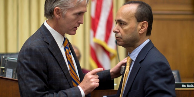 Rep. Trey Gowdy, R-S.C., left, talks with Rep. Luis Gutierrez, D-Ill., on Capitol Hill in Washington.