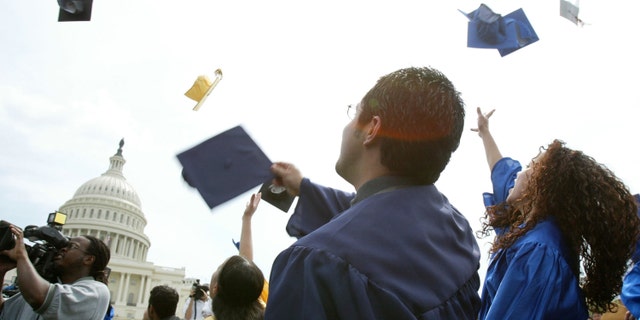 WASHINGTON - APRIL 20: Students throw their caps during a mock graduation ceremony at the West Front of the U.S. Capitol April 20, 2004 in Washington, DC. Several hundred students and advocates took part in the ceremony and urged Congress and the Bush administration to pass the Dream Act, which would put U.S.-raised immigrant students on the path to college and U.S. citizenship. (Photo by Alex Wong/Getty Images)