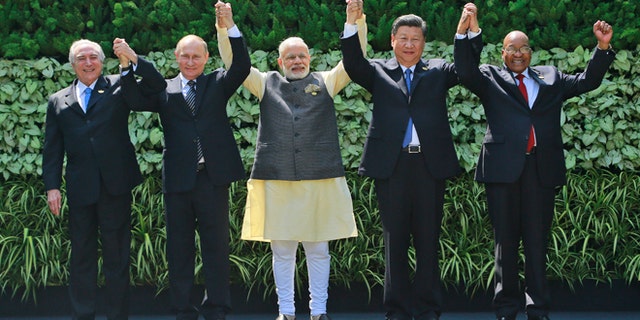 Brazilian President Michel Temer, Russian President Vladimir Putin, Indian Prime Minister Narendra Modi, Chinese President Xi Jinping, and South African President Jacob Zuma in Goa, India, Sunday, Oct. 16, 2016.