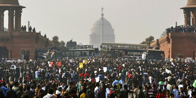 Dec. 22, 2012: In this file photo, protesters gather outside the Indian Presidential Palace during a rally against the gang rape and brutal beating of a 23-year-old student on a moving bus in New Delhi, India.