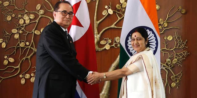 FILE – In this Monday, April 13, 2015 file photo, Indian Foreign Minister Sushma Swaraj, right, shakes hands with North Korea's Foreign Minister Ri Su Yong in New Delhi, India. Ties are warming between New Delhi and Pyongyang, with mineral-hungry India looking to boost trade while North Korea, facing sometimes-rocky relations with China, searches for new friends. The goodwill began earlier this year, when North Korea dispatched Ri on a three-day trip to India, just a few weeks before Prime Minister Narendra Modi flew to Seoul for meetings with South Korean President Park Geun-hye. (AP Photo/Manish Swarup, File)