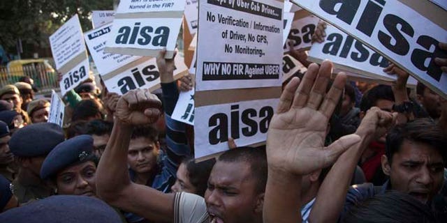 Dec. 7, 2014: Protestors from All India Students Association (AISA) demonstrate outside the Delhi Police headquarters after a taxi driver from the international cab-booking service Uber allegedly raped a young woman Friday in New Delhi, India. (AP)