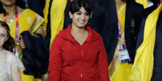 July 27, 2012: A cast member is shown walking with the Indian team during the Opening Ceremony at the 2012 Summer Olympics.