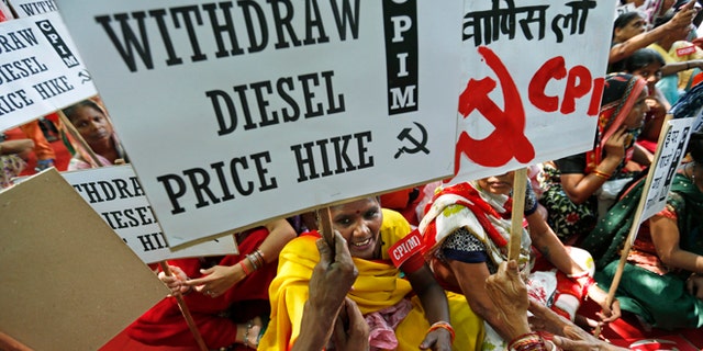 Sept. 20, 2012: Supporters of Communist Party of India (Marxist) participate in a protest with placards in New Delhi, India.