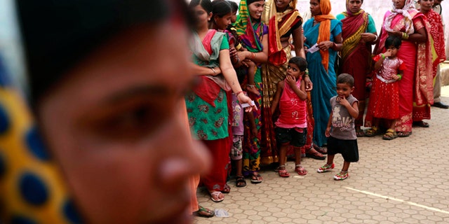 April 17, 2014: Indian women stand in a queue to cast their votes in Rajnandgaon, in the central Indian state of Chhattisgarh, now the center of India's four-decade Maoist insurgency.