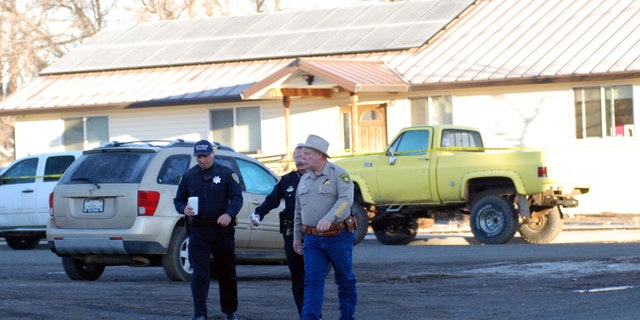 Feb. 21, 2014: Modoc County Sheriff and Coroner Mike Poindexter, right, walks away from the Cedarville Rancheria tribal headquarters building in Alturas, Calif.