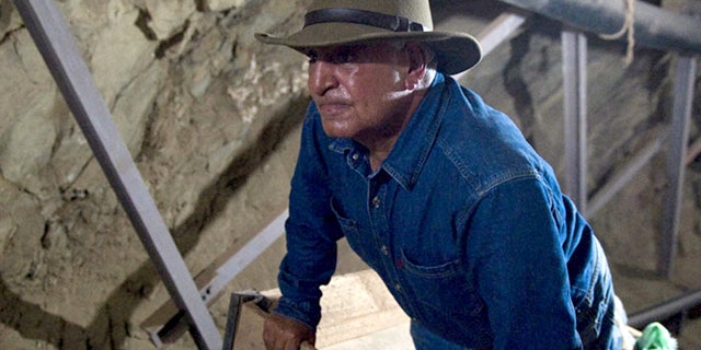 June 30, 2010: Looking for all the world like Indiana Jones, antiquities chief Zahi Hawass studies an unfinished 570-foot long tunnel in Luxor, Egypt -- first discovered in 1960 and possibly meant to be a secret tomb.